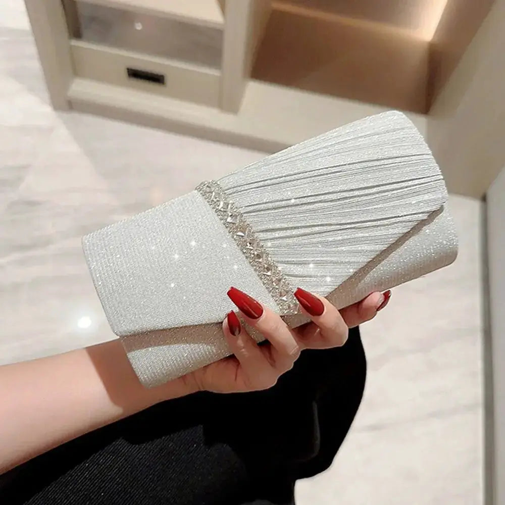 Evening sequins clutch bag in silver with pleated flap and crystal chain embellishment