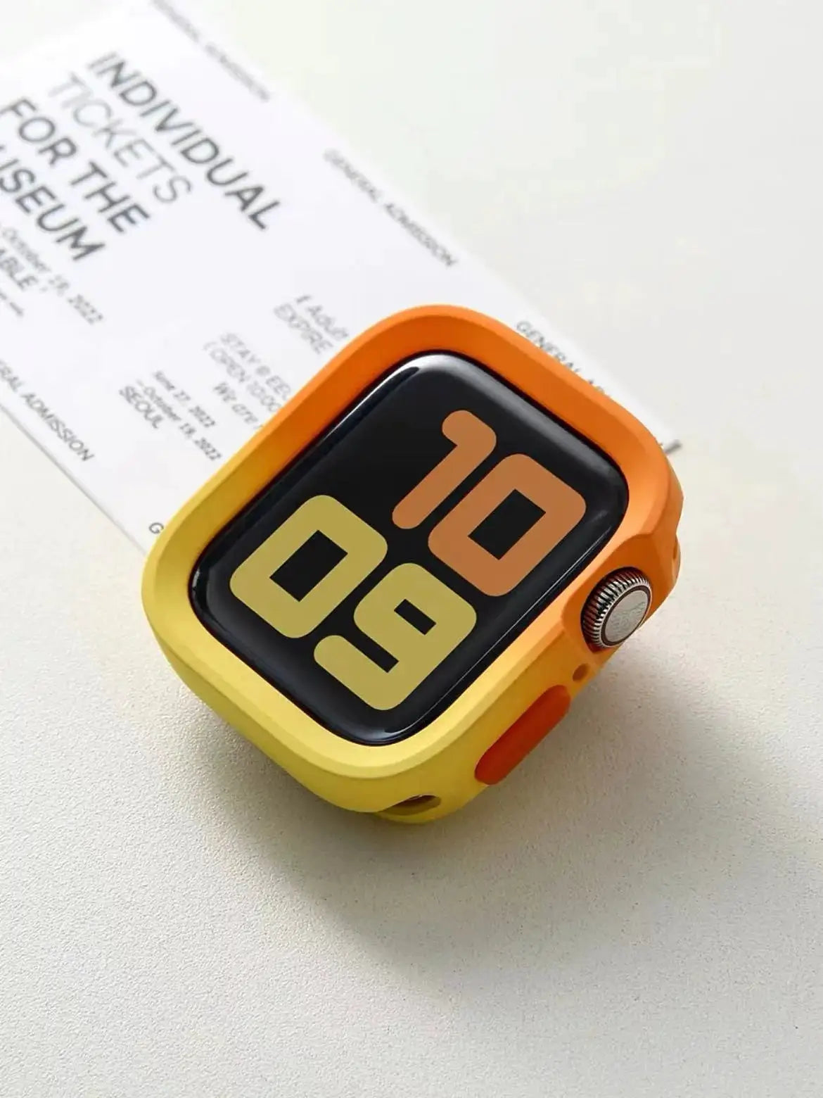 Simples Market bumper silicone case for Apple Watch in orange-yellow gradient with anti-drop protection.