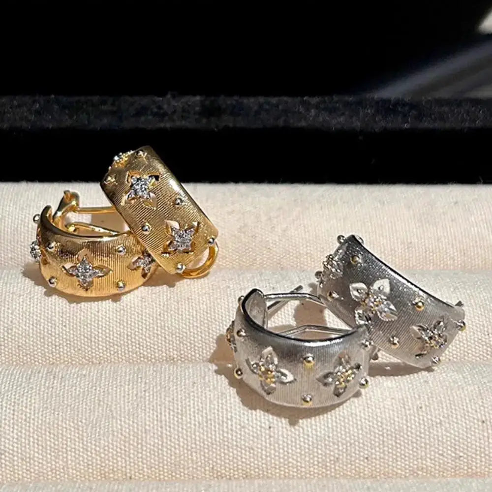 Simples Market set of four hollow flower earrings in gold-tone and silver-tone with zircon inlays
