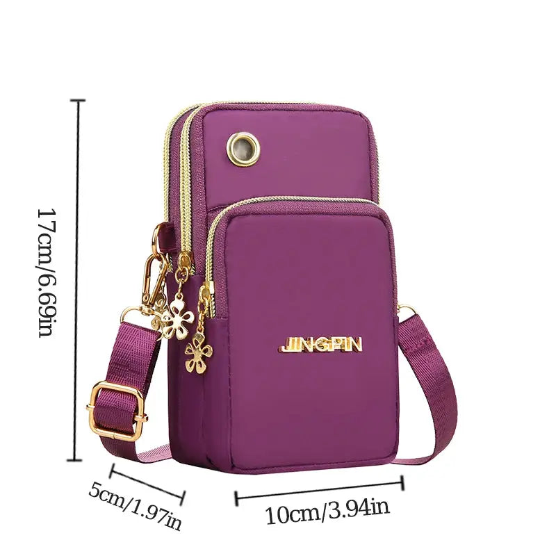 Purple crossbody mini phone bag by JINGPIN with gold hardware, dual zippers and flower charms