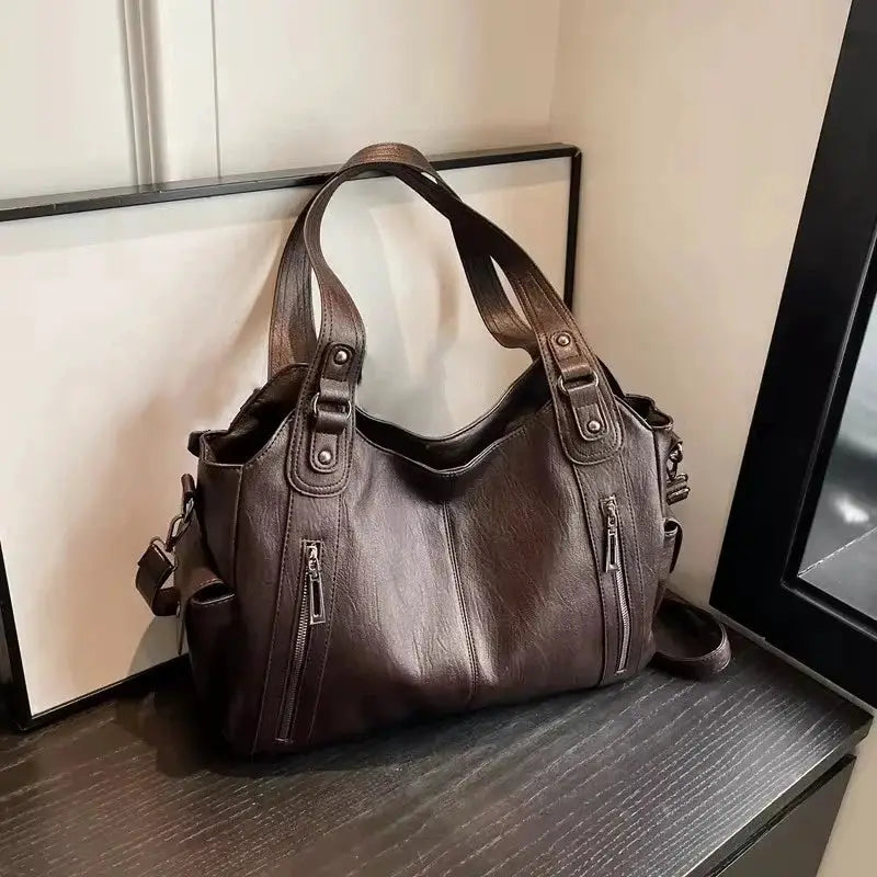 Shoulder bag in brown PU leather with dual top handles and front zip pockets