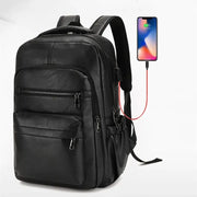 USB charging PU leather backpack with built-in charging capability and smartphone connected.