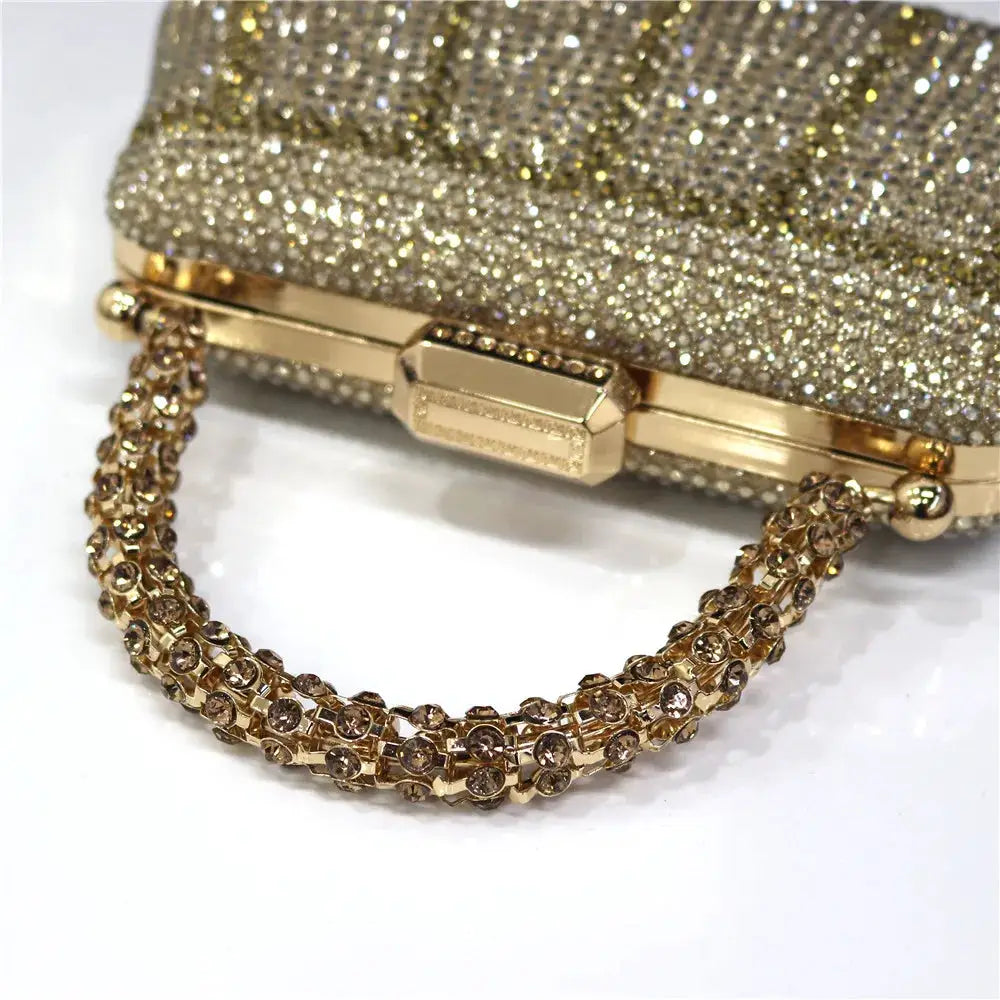 Gold tone Simples Market evening clutch with diamond rhinestone design and chain strap