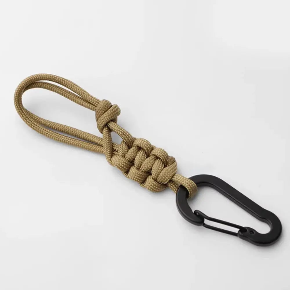 Simples Market outdoor paracord keychain with black carabiner, tan woven knot loop