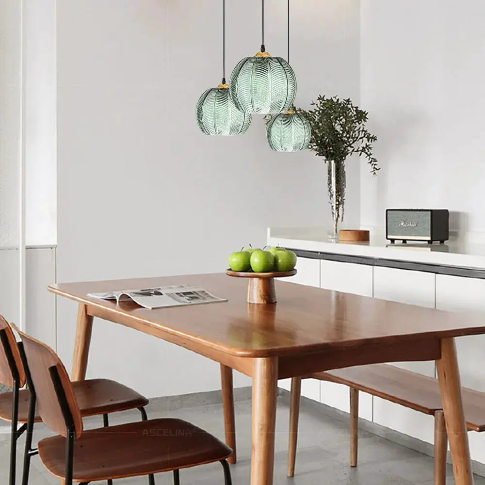 Nordic green leaf-patterned glass pendant lights; Simples Market, set of 3 over wooden dining table