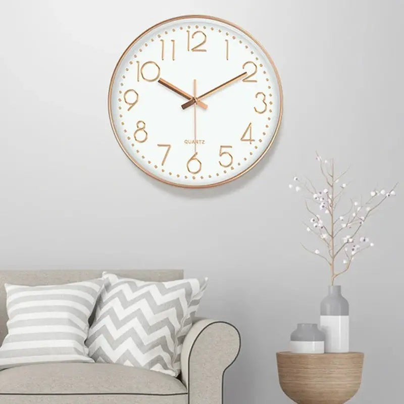8-inch wall clock with a gold-tone frame, white dial, and gold numerals.