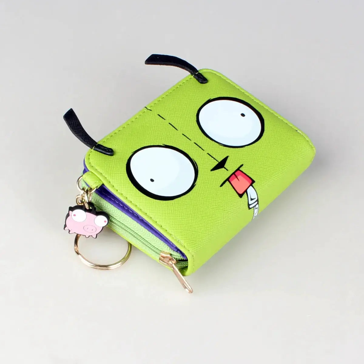 Simples Market 3D face trifold wallet in lime green with purple zipper and pig charm key ring