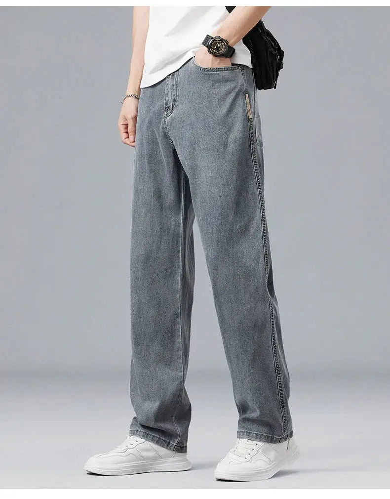 Simples Market men's loose straight lyocell denim jeans in light blue with soft drape fabric.