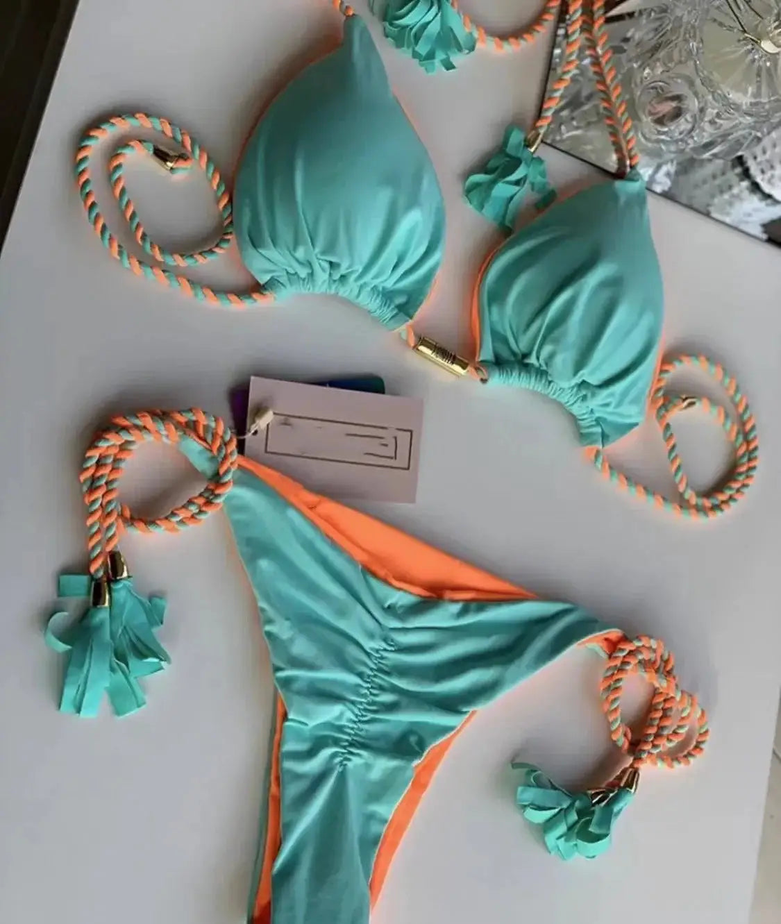 Women backless rope-trimmed triangle bikini in turquoise and orange multicolor