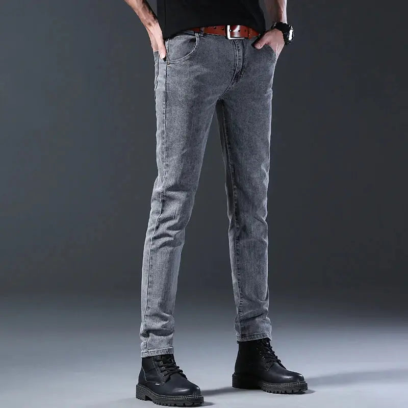 Men's slim-fit gray denim jeans with mid-rise and straight leg for casual wear.