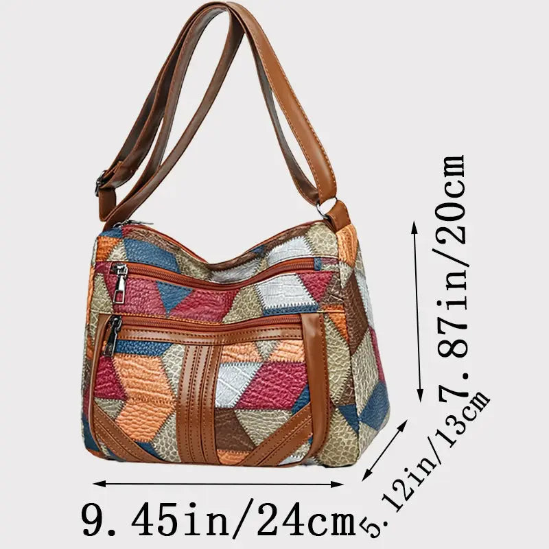 Women's crossbody shoulder bag by Simples Market, colorful geometric patchwork with leather trim and zip pockets.