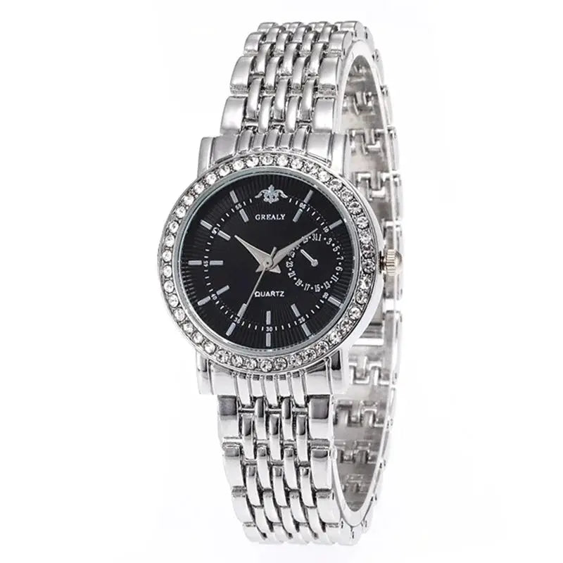Women’s luxury quartz watch with black dial, round rhinestone bezel and silver metal bracelet.