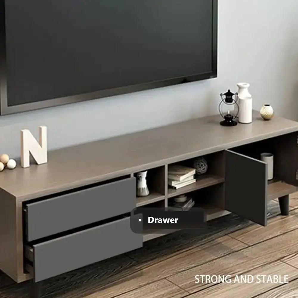 Modern TV stand with two gray drawers and an open cabinet door on a brown wood top
