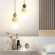 Simples Market cream-style pair of pendant lamps with wood bead accents and warm glass bulbs