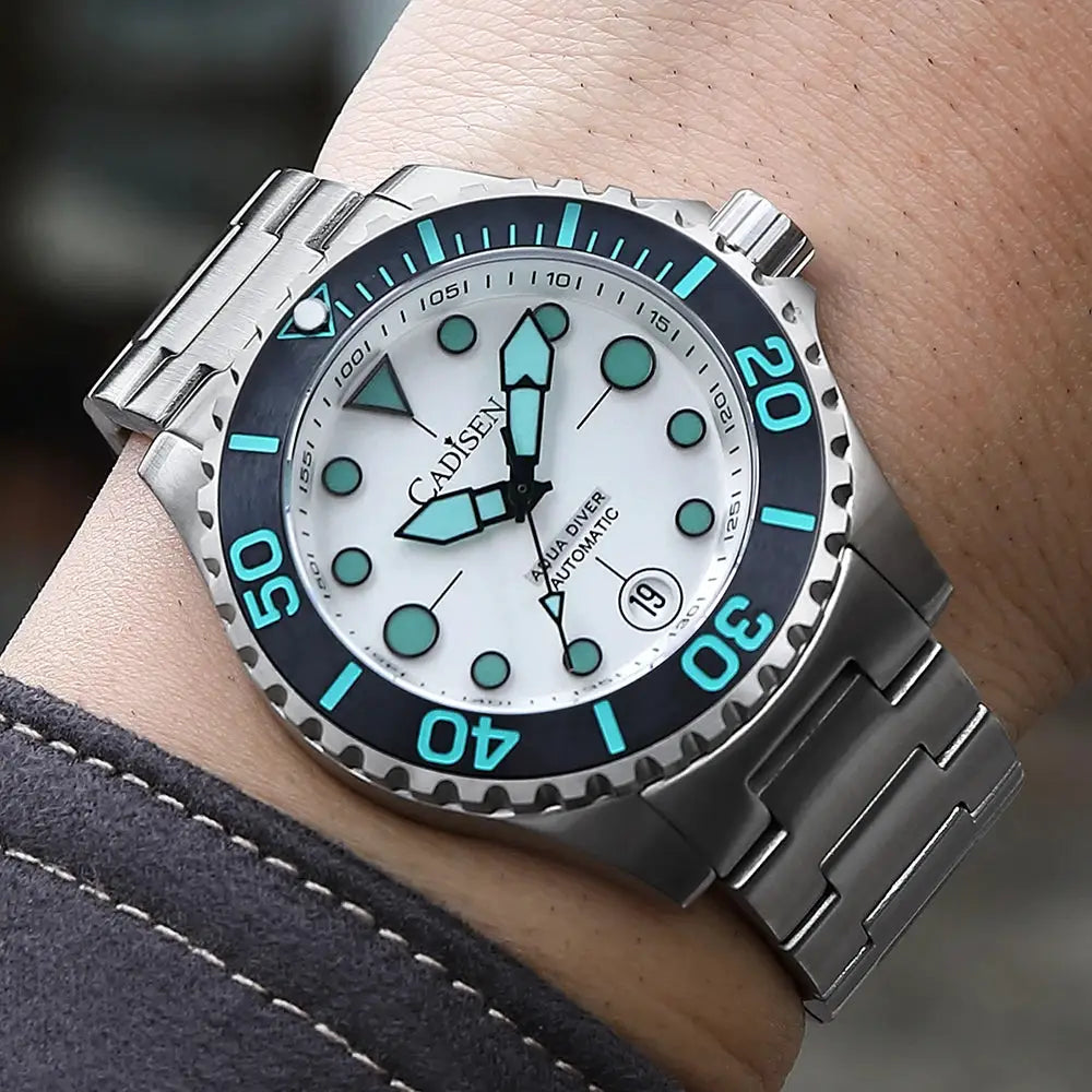 Cadisen Aqua Diver automatic men's watch with white dial, turquoise markers, blue bezel, stainless steel bracelet.