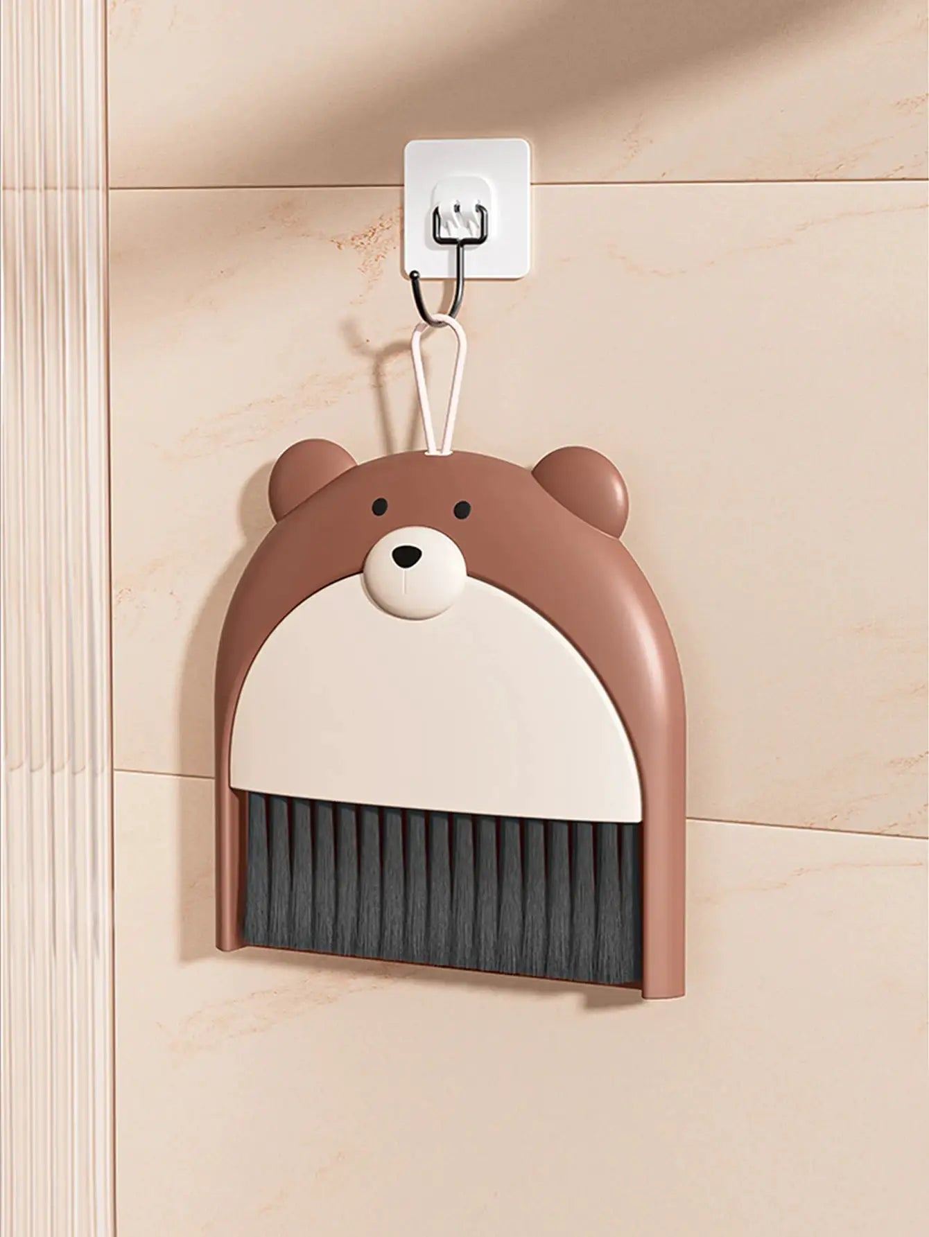 Bear-shaped broom and dustpan set; brown cartoon teddy with white face, wall-mounted mini cleaning tool