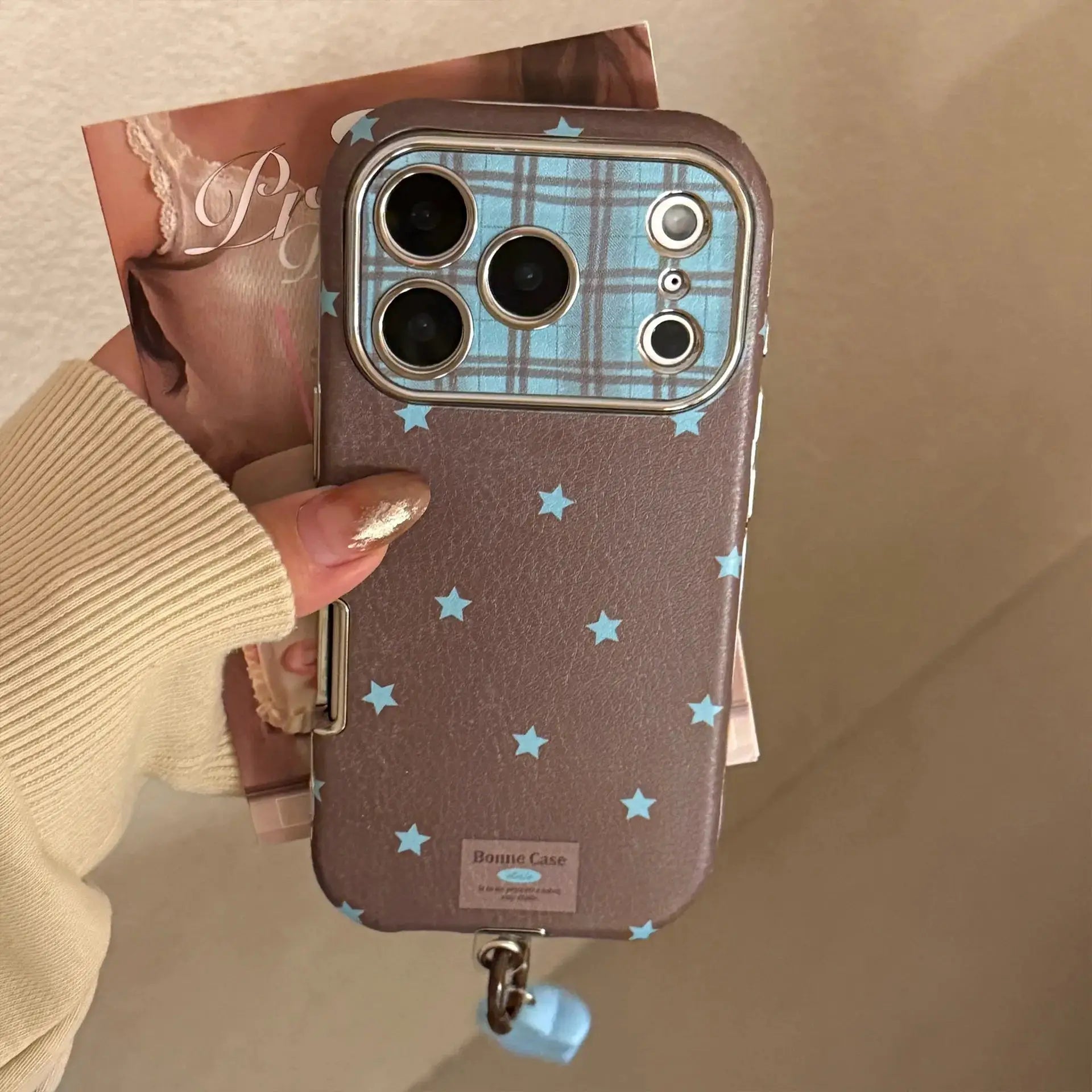 Simples Market Bonnie Case Korean Retro Stars plated leather iPhone case with pendant, brown with blue stars.