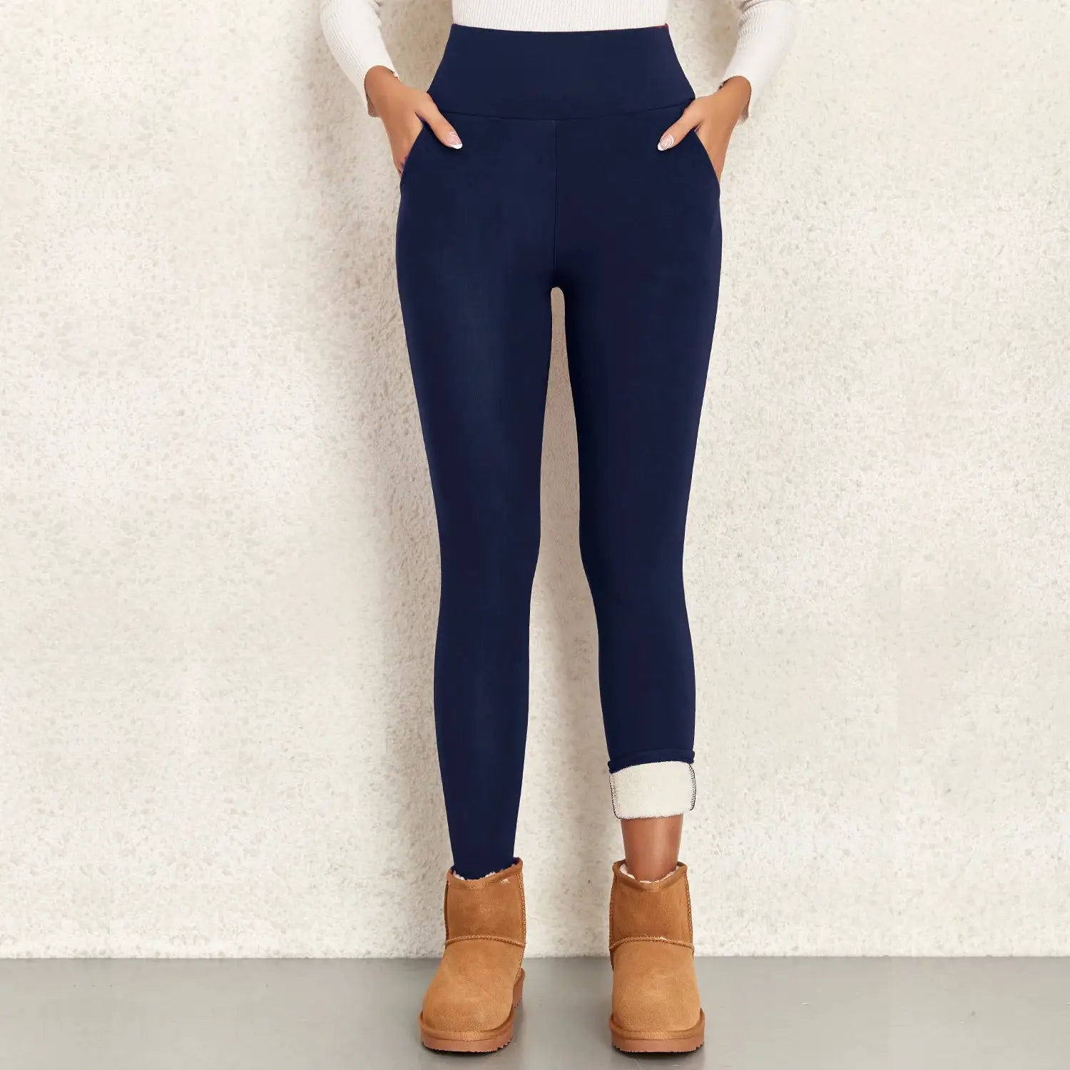 Women's navy fleece-lined high-waist leggings with pockets; soft, stretchy thermal pants