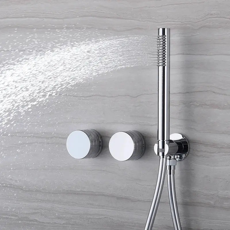 Chrome handheld shower head by Simples Market with wall-mount and dual control knobs