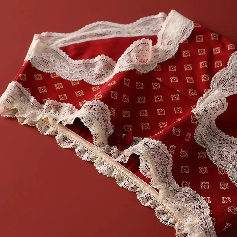 Triangular panties set in red cotton with white lace trim and bow detail