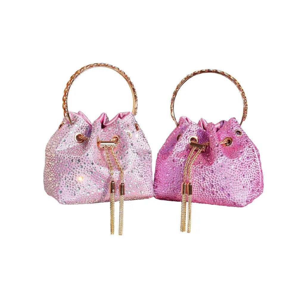 Pair of pink rhinestone evening clutch bags with gold ring handles