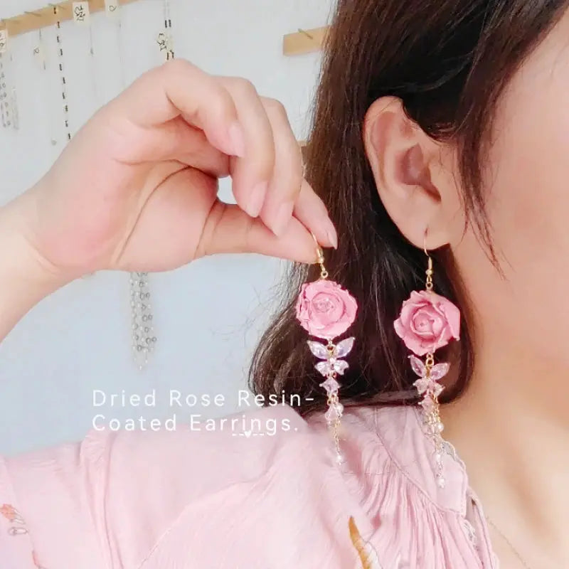 Elegant Immortal Rose long earrings with pink rose epoxy resin and crystal drops — Simples Market