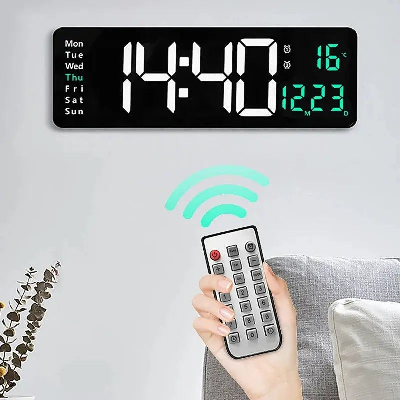 Large black digital wall clock with remote; wall-mounted LED display shows time, date, day of week, and temp