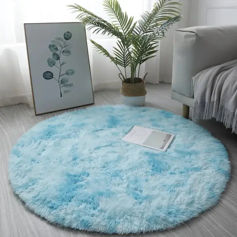 Round plush rug with fluffy light blue pile, ideal living room decor.
