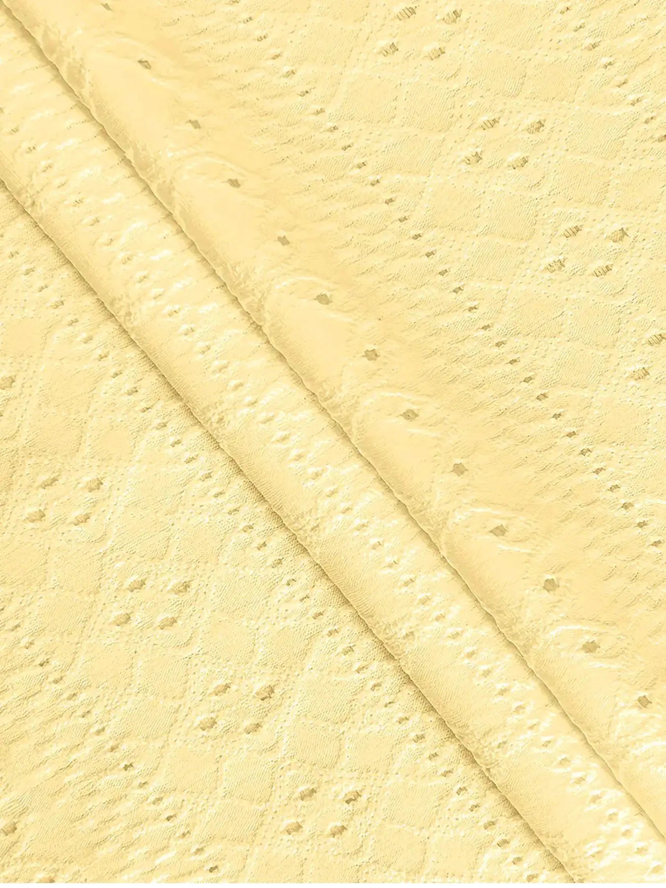 Lace fabric in pale yellow close-up by Simples Market