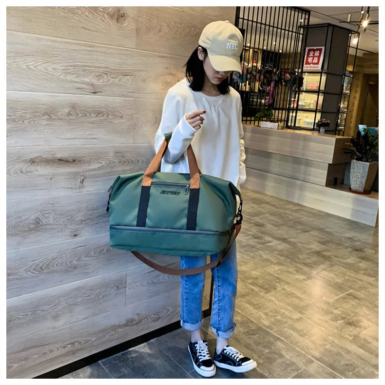 Travel gym bag by Simples Market, teal-green with tan handles and brown detachable shoulder strap