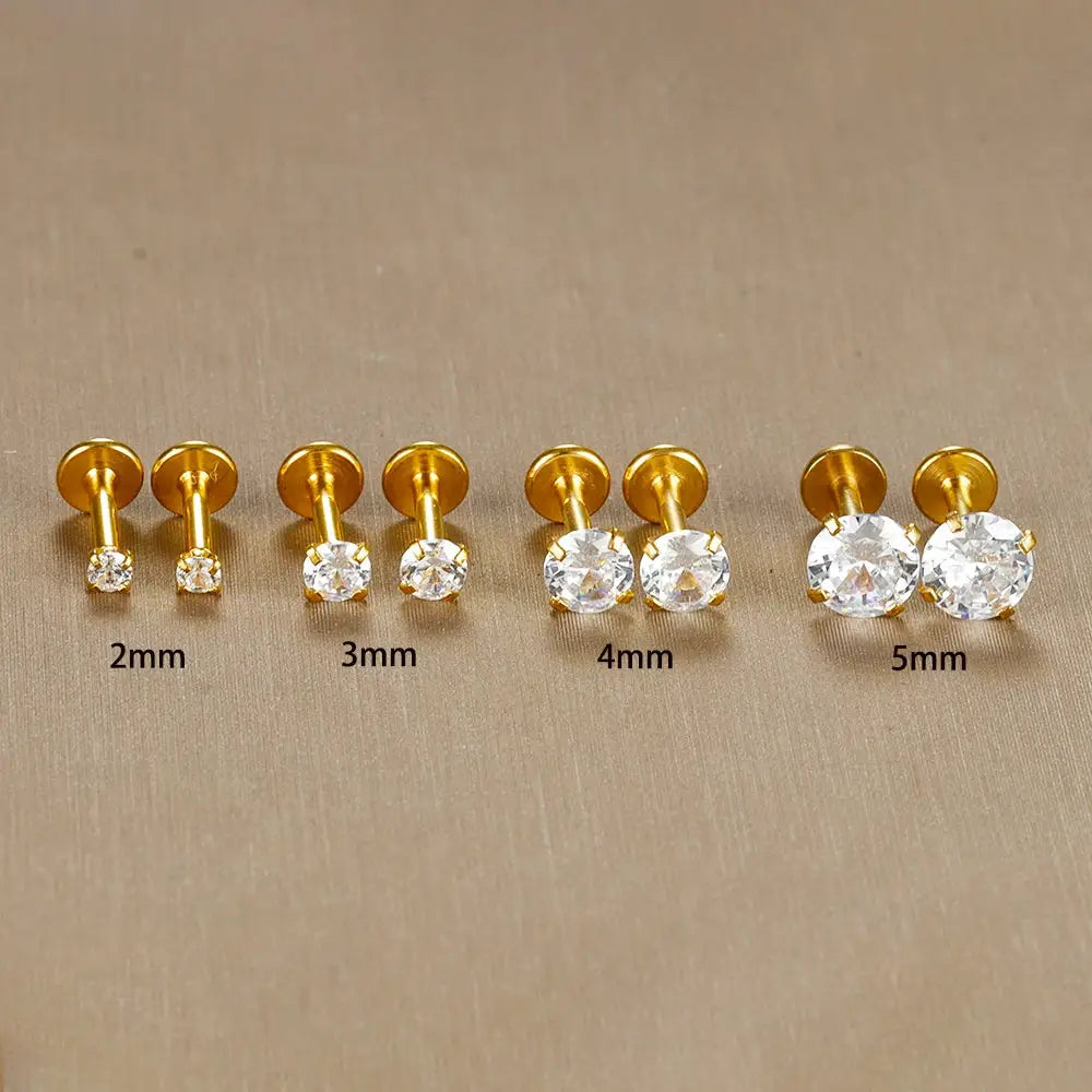 Gold-tone labret stud earrings, four sizes (2mm–5mm) with clear CZ crystals