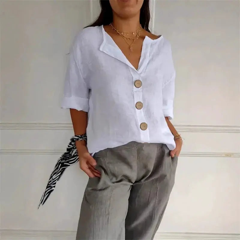 Summer loose shirt by Simples Market, white cotton-linen button-front top with short sleeves, V-neck and beige buttons.