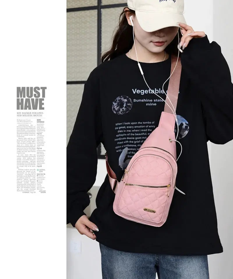 Minimalist large-capacity pink quilted chest bag with front pocket, worn as a crossbody.