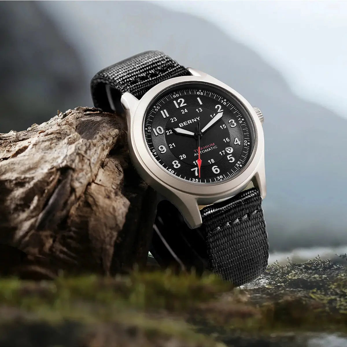 BERNY titanium automatic field watch for men with black dial, white numerals, red seconds hand, and black nylon strap