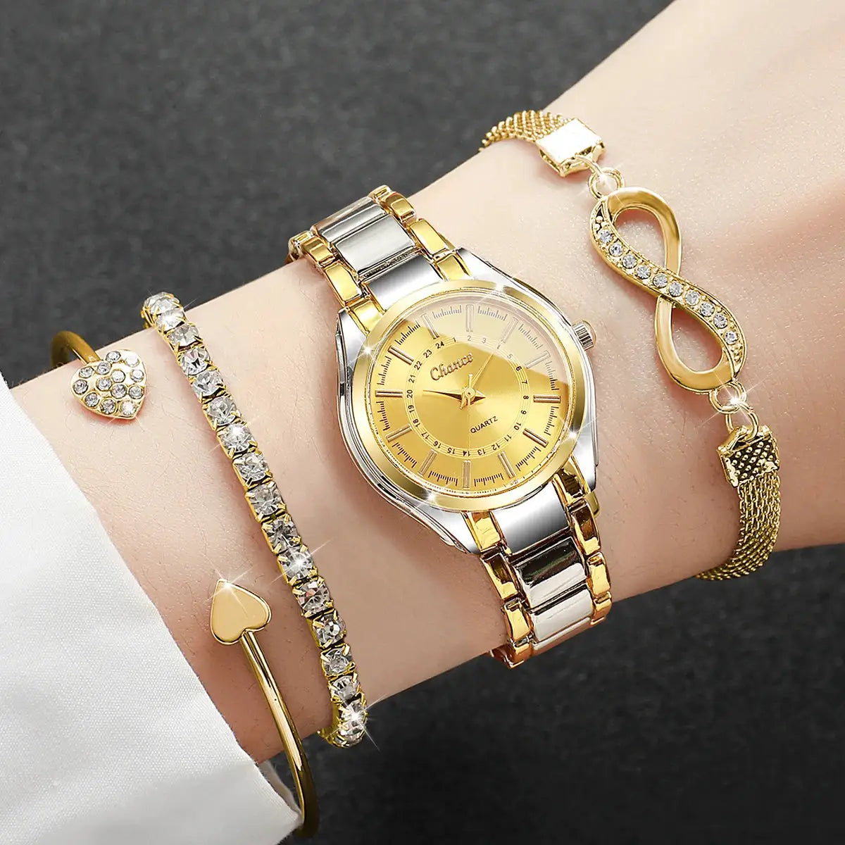 4-piece women's watch and bracelet set with a gold-tone two-tone analog quartz watch and rhinestone bracelets