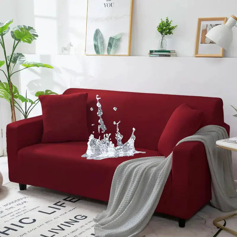Sofa cover red waterproof stretch slipcover on a living room couch with a gray throw blanket