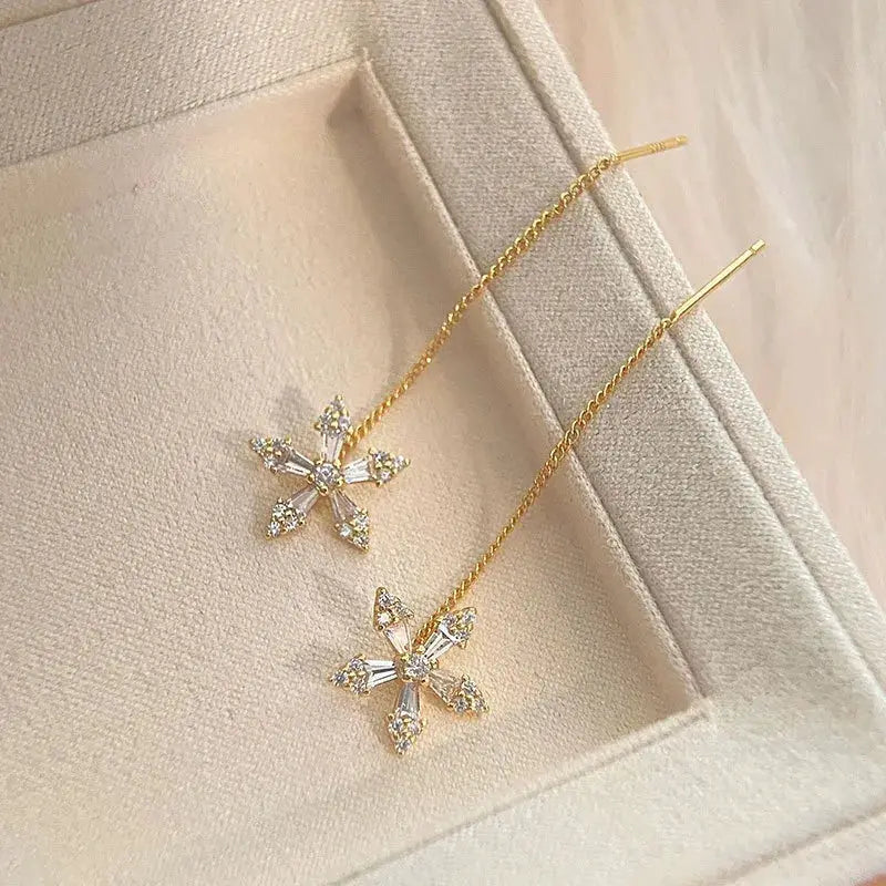 Pair of gold-tone long thread chain drop earrings with crystal star pendants