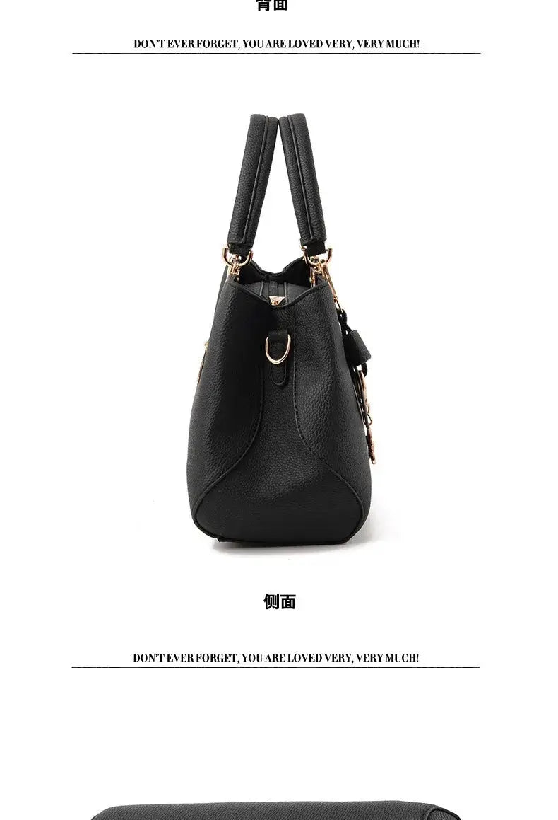 Simples Market black faux leather shoulder bag with dual top handles and gold hardware