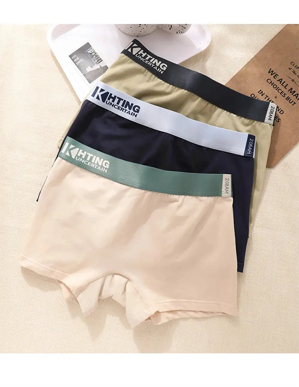4-pack women's cotton panties with high-elastic waistbands; colors beige, navy, khaki, cream; visible KHTNG branding.