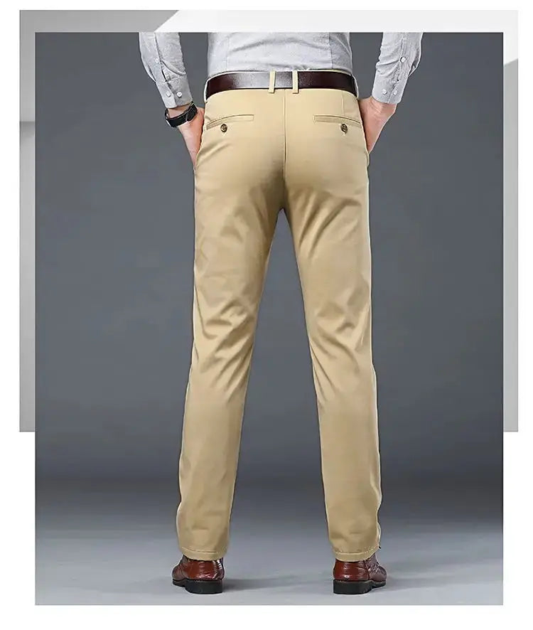 Men's slim-fit khaki cotton suit pants, back view with two rear pockets and brown belt.