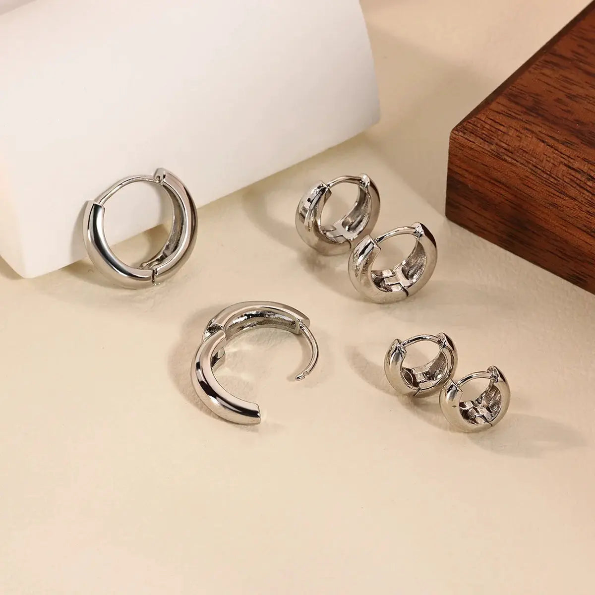 Classic hoop earrings by Simples Market; silver-tone stainless steel set in multiple sizes