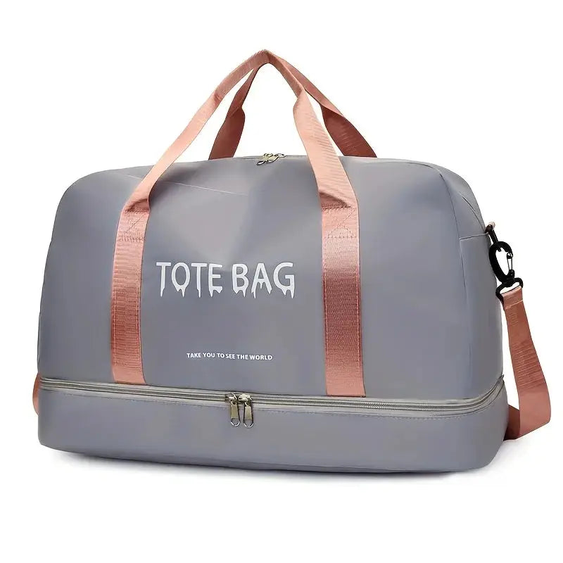 Grey nylon travel duffle bag with pink handles and detachable shoulder strap, large-capacity gym bag.