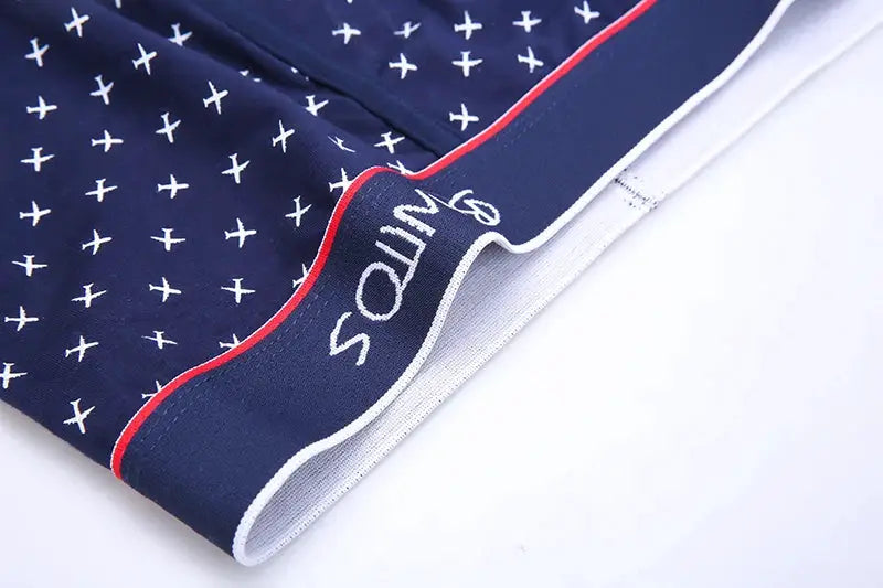 Simples Market 4-pack navy cotton men's boxer shorts with white X pattern, red piping and SIM logo on waistband