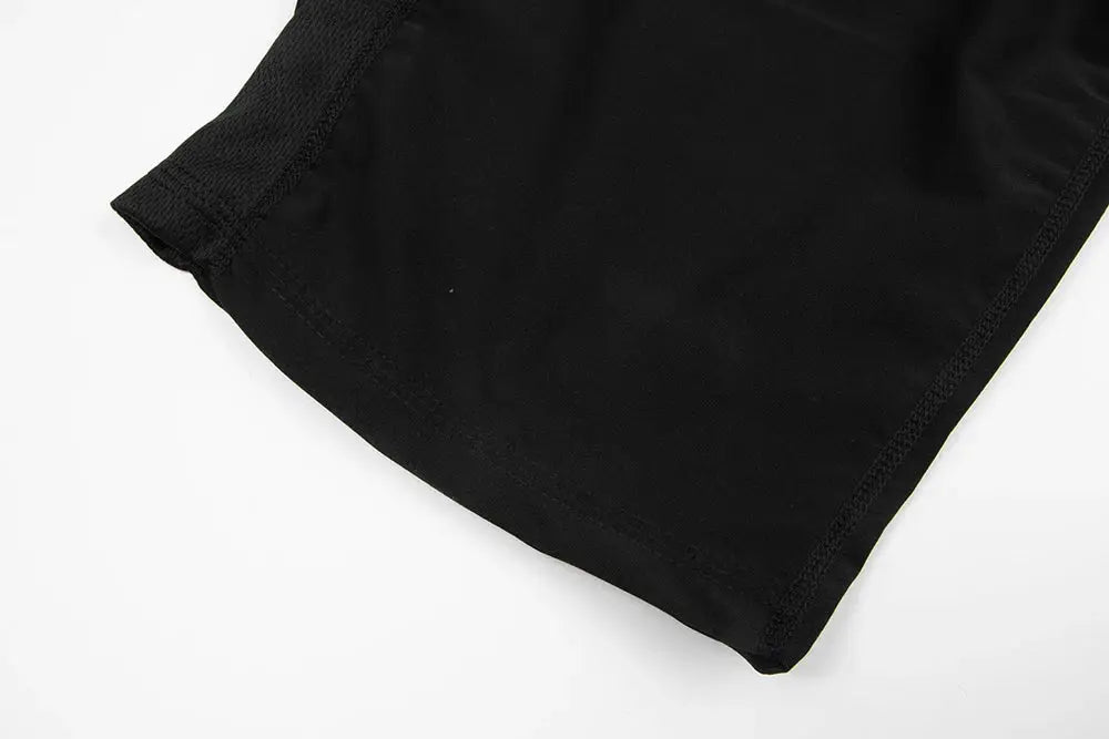 Black waist trainer sauna jumpsuit fabric close-up showing the stitched hem