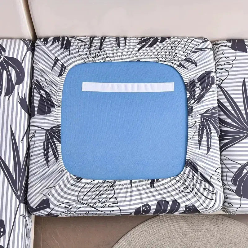 Elastic sofa seat cushion cover with floral print, blue inner cushion visible; removable and anti-dust fabric.