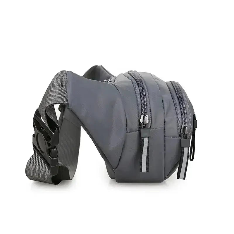 Men's gray canvas waist pack with multiple zip pockets and adjustable strap.