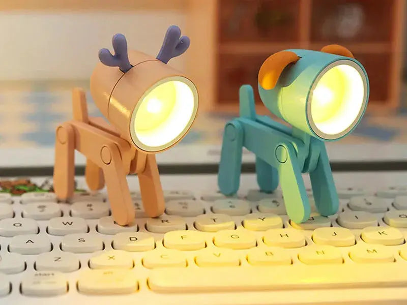 LED mini night lights; Simples Market dog and deer foldable desk lamps in peach and teal on keyboard.