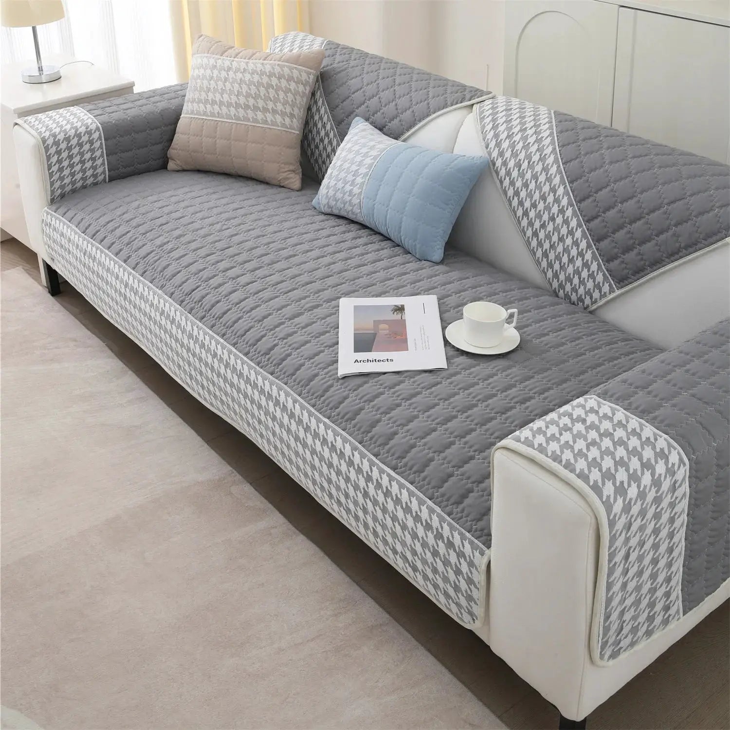 Sofa cover set in gray houndstooth quilted design with anti-slip edges by Simples Market