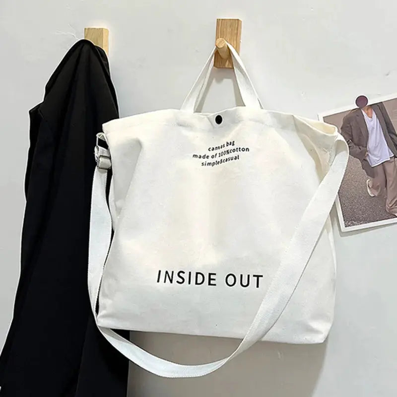 Canvas tote bag by Simples Market, white with long crossbody strap and handles, INSIDE OUT print, large capacity.