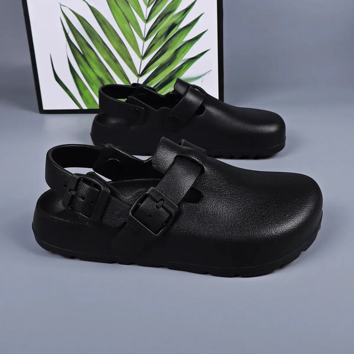 Pair of Simples Market black platform clogs for women with adjustable buckle straps and chunky soles
